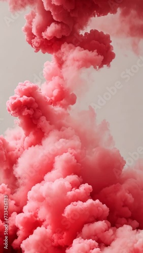Red colored smoke on a white background 4K vertical video	
