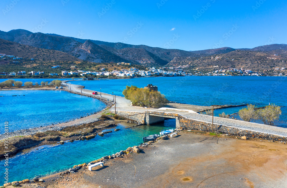 The famous canal of Elounda with the ruins of the old bridge, Crete, Greece.