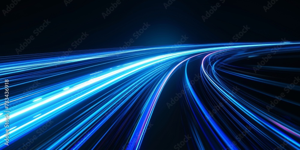 Blue light trails create a dynamic and futuristic abstract image representing speed and technology. Blue light trails create a dynamic and futuristic abstract image representing speed and technology.