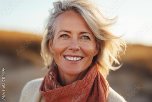 Portrait of confident mature blond woman looking ahead photo