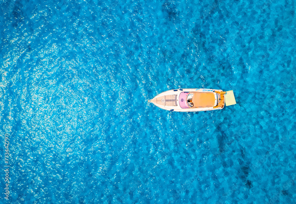 Aerial view of beautiful luxury yacht in blue sea in summer Aerial view of beautiful luxury yacht in blue sea in summer