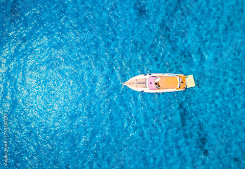 Aerial view of beautiful luxury yacht in blue sea in summer