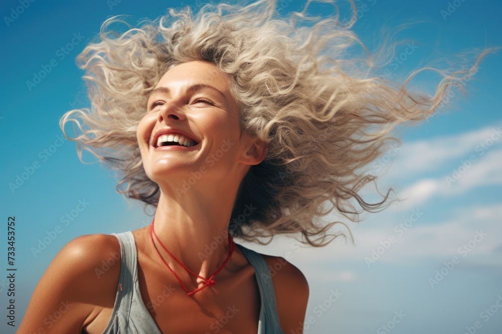 Happy smiling grey-haired woman against the blue sky. Wind in the hair. AI Generated Happy smiling grey-haired woman against the blue sky. Wind in the hair. AI Generated