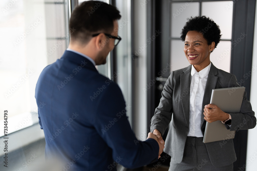 Image of businessman and businesswoman handshake Image of businessman and businesswoman handshake