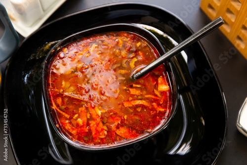 National dish of Russian cuisine is Solyanka soup, served with sour cream