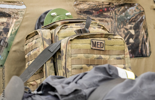 A professional military grade medkit, infantry army med kit, bag of medical supplies and equipment green camo bag closeup, nobody. War, warzone medics, help for the injured soldiers simple concept photo