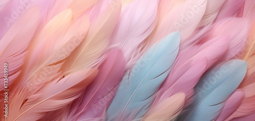 Multicolored feathers in pastel colors in shades of pink, peach, and green. Feathers texture background. Use as Backdrops for design projects, Fashion or decor. Concept of Softness and elegance.