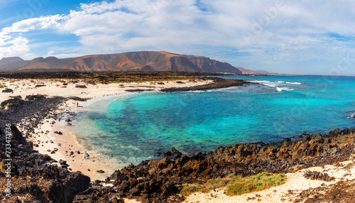 Panoramic view of the Natural Monument of the Volcano de La Corona and Jabillo beach on the coast of the North Atlantic Ocean in Lanzarote, Canary Island, Spain