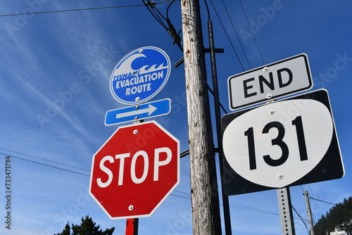 End of highway 101, Netarts Oregon. Tsunami evacuation sign. Stop sign. photo