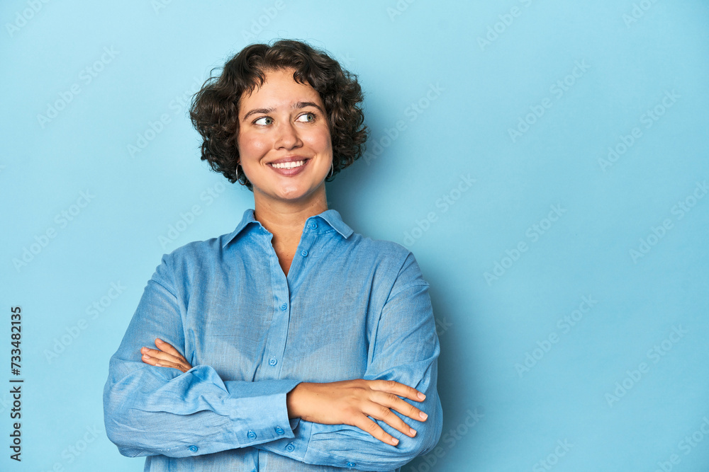 Young Caucasian woman with short hair smiling confident with crossed arms. Young Caucasian woman with short hair smiling confident with crossed arms.