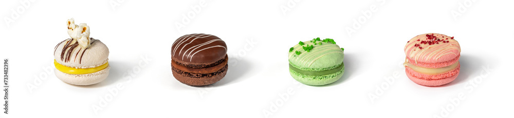 Set of colored macaroon cookies with strawberry, pop corn, chocolate, pistachios isolated on white background. Candy bar, sweets and dessert Set of colored macaroon cookies with strawberry, pop corn, chocolate, pistachios isolated on white background. Candy bar, sweets and dessert