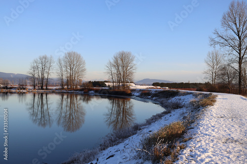 Fototapeta Naklejka Na Ścianę i Meble -  Winter scenery with snow on river dykes
