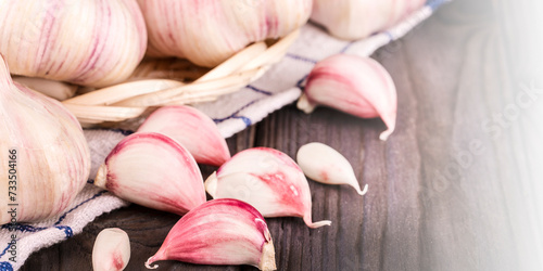 Garlic. Garlic Cloves and Garlic Bulb on kitchen towel, concept healthy lifestyle.