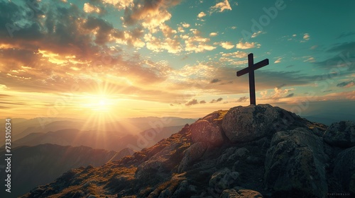 Majestic cross stands atop mountain, illuminated by golden sunrise, conveying hope and spiritual inspiration, Good Friday and Easter Sunday concept photo