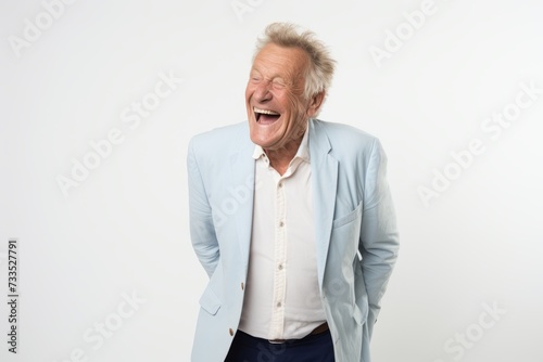 Portrait of a senior man laughing isolated on a white background.