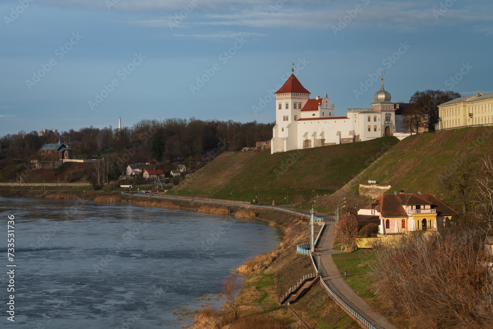 View of the Grodno Old Castle (Grodno Upper Castle) on the banks of the Neman River on a sunny day, Grodno, Belarus