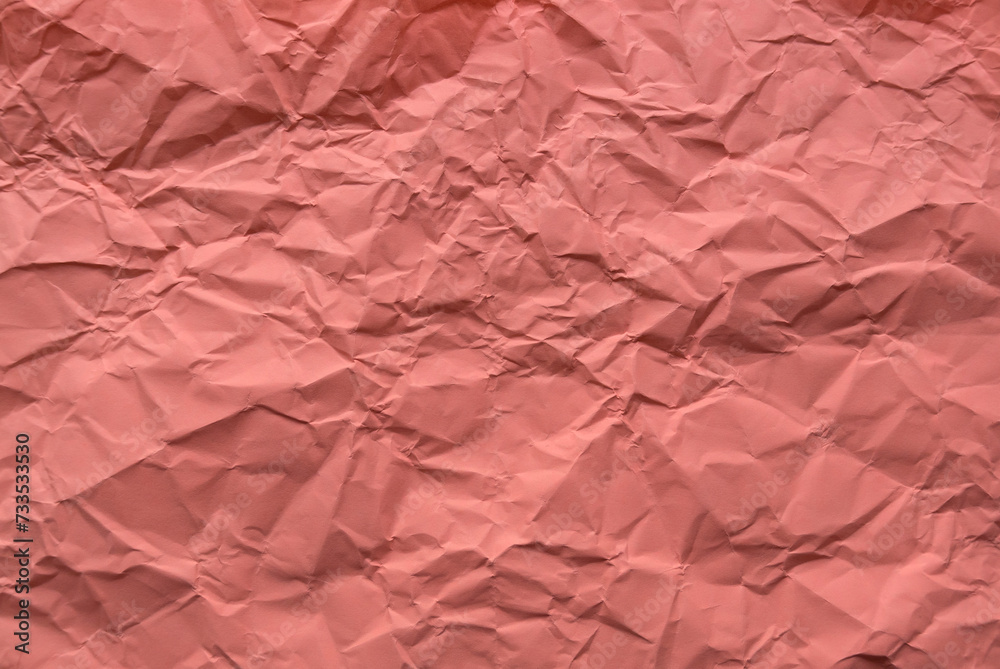 Fototapeta premium Peach color crumpled paper for background.