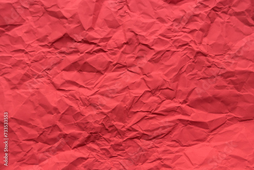 Red color crumpled paper for background.