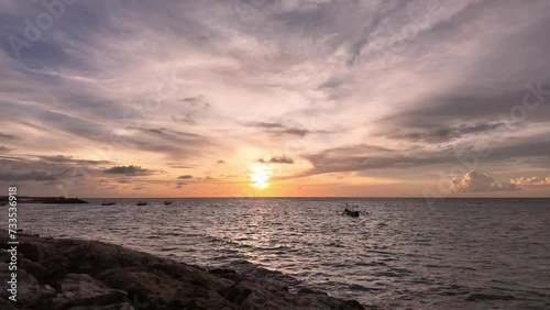 Timelapse of the sunset over the sea in Kuta Bali with the beauty of the changing colors of the sky