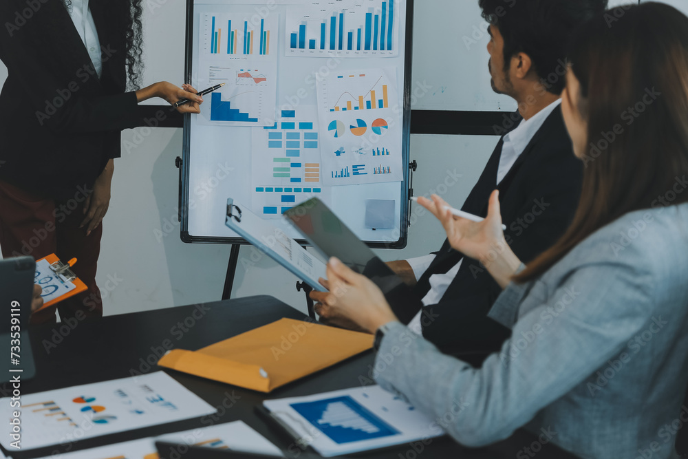 Business team meeting working with new startup project, discussion and analysis data the charts and graphs. Digital tablet, calculator, laptop computer using, Business finance and accounting concept.