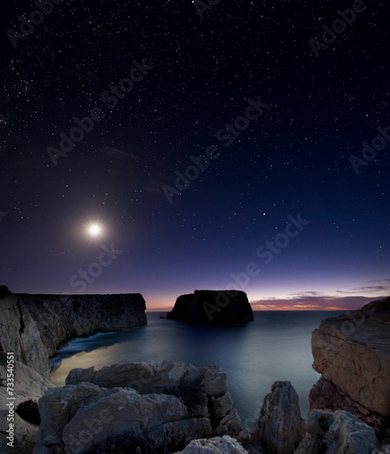 moon over the island Piana, Alghero Sardinia, Italy photo