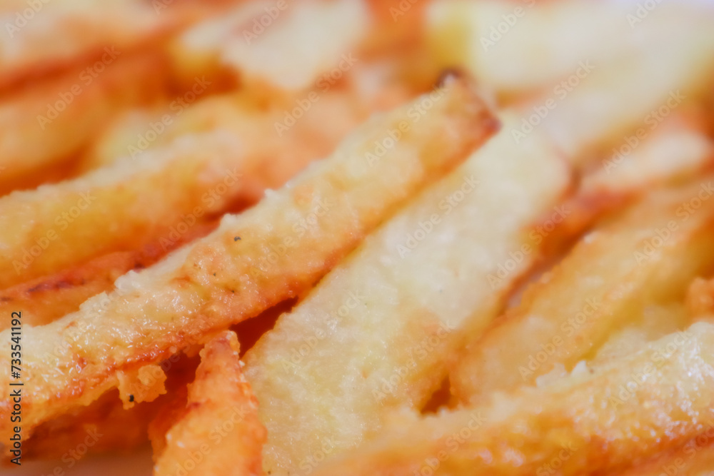 photo of delicious french fries or french fries fresh potatoes fried color potato background photo of delicious french fries or french fries fresh potatoes fried color potato background