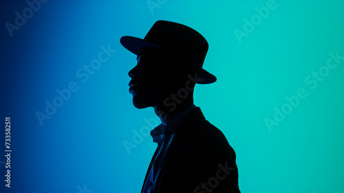 Young afro american man wearing hat against blue cool background photo