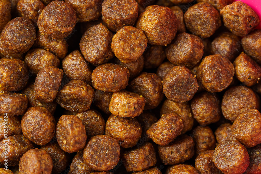 Dry pet food granules for background top view Dry pet food granules for background top view