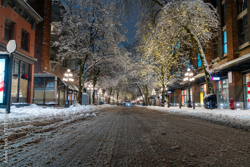 Vancouver, British Columbia - Canada. Downtown iconic landmark on a snowy night just after a snowstorm, the Steam Clock, Gastown- Vancouver, British Columbia, Canada.