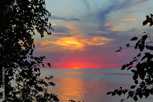 Photography Colorful sunset on the shore of Lake Chudskogo