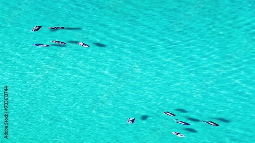 Drone footage of jet-skis in the clear Indian Ocean near the shore of Western Australia, Australia photo