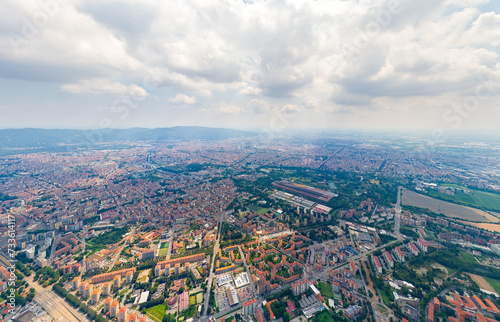 Turin  Italy. Panorama of the city in summer. Industrial and residential areas. Fields. Aerial view