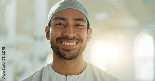 Face, smile and Muslim man in mosque on lens flare with prayer cap to worship God, Allah and praise. Portrait, happy and Islamic person in temple in hat for faith, culture and funny laugh in UAE. photo