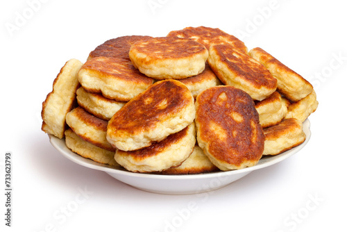 Plate with homemade pancakes on white background. Pile of pancakes in plate isolated on white background.