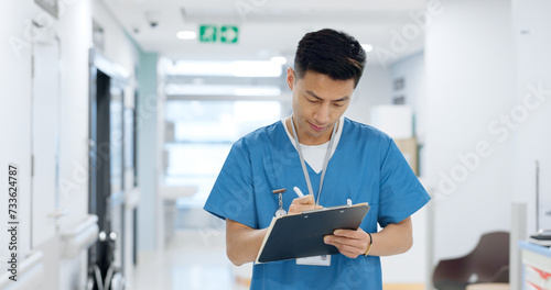 Doctor, planning and writing in documents, medical checklist or charts for hospital notes or clinic service. Healthcare worker, asian man or nurse smile for clipboard, paperwork or thinking in clinic photo