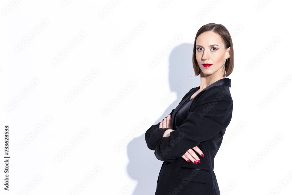 Successful Women In Business. Portrait of Winsome Positive Confident Caucasian Business Woman in Black Suit Posing Over White Successful Women In Business. Portrait of Winsome Positive Confident Caucasian Business Woman in Black Suit Posing Over White