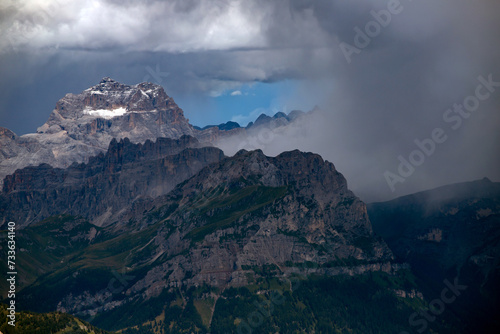 Panoramic view from the top of the Marmolada Glacier in summer mist, Dolomites, South Tyrol, Italy.