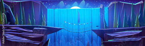 Rope bridge hanging between edges of dangerous rock cliff with background of high waterfall at night. Dark dusk cartoon natural landscape with adventure footbridge road over wide river in mountains.
