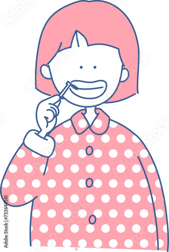 歯間ブラシをする女の子