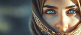 Portrait of a young Arab model in hijab with blue eyes. Traditional clothing. Banner