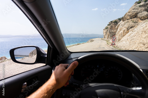Driver seat view over the coastal road along Salda lake in Burdur Province of Turkey
