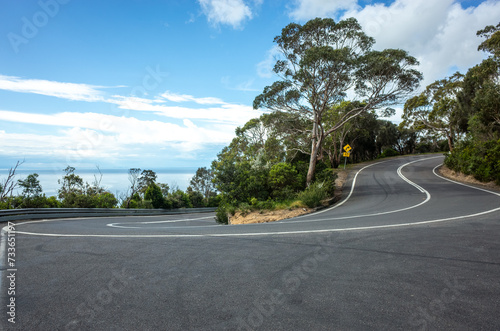 Zig zag scenic road on a dangerous mountain highway with a view of the bay. Arthurs Seat State Park, Mornington VIC Australia. photo