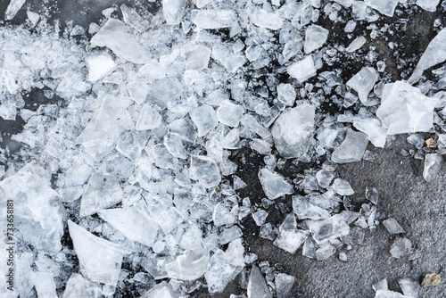 Pieces of ice on the asphalt.