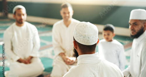 Islam, discussion and group of men in mosque with child, mindfulness and faith gratitude. Worship, religion and love, Muslim people together in holy temple for praise and spiritual teaching with boy. photo