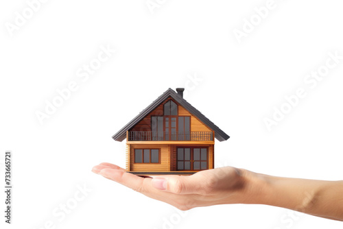 Miniature house model in human hand on transparency background PNG