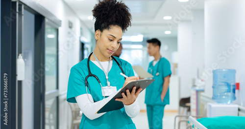 Fotografie Doctor, holding and writing on clipboard in hospital for patient, care or treatment after exam in emergency room