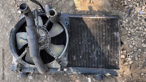 Used car radiator with fan and rubber hose