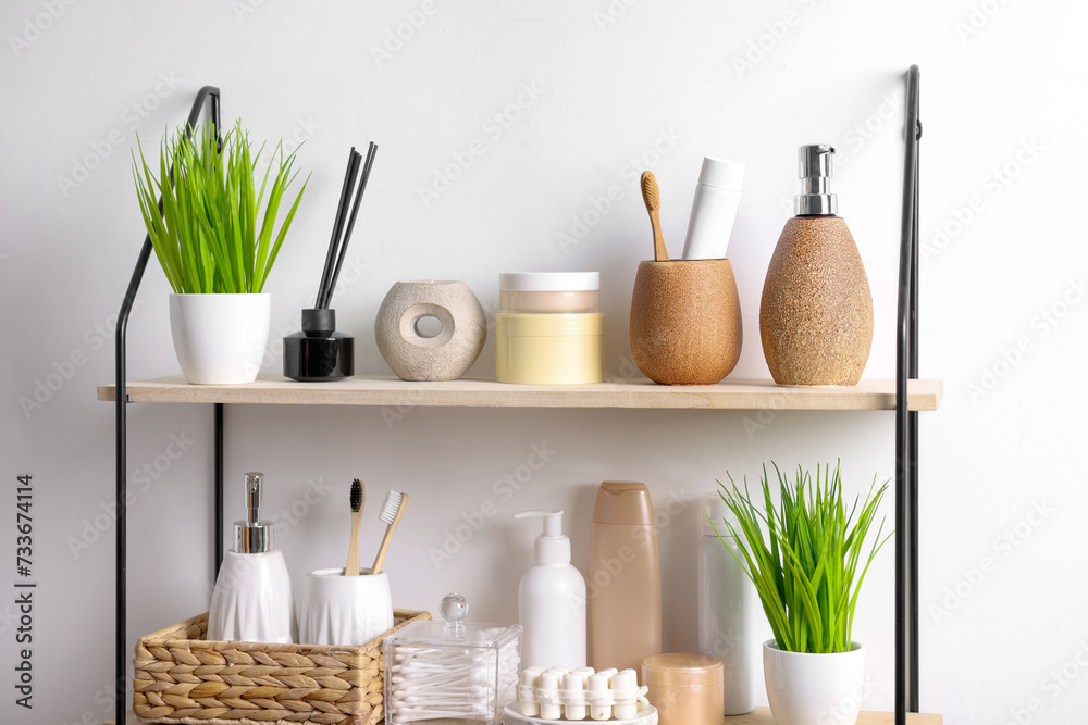 Different bath accessories, personal care products and artificial plants indoors Different bath accessories, personal care products and artificial plants indoors