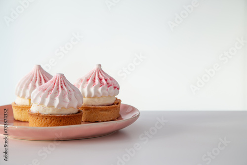 cupcake on pink plate  on white table