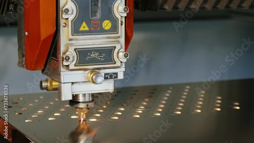 Cutting metal with a laser with sparks. Laser cutting technology close up
